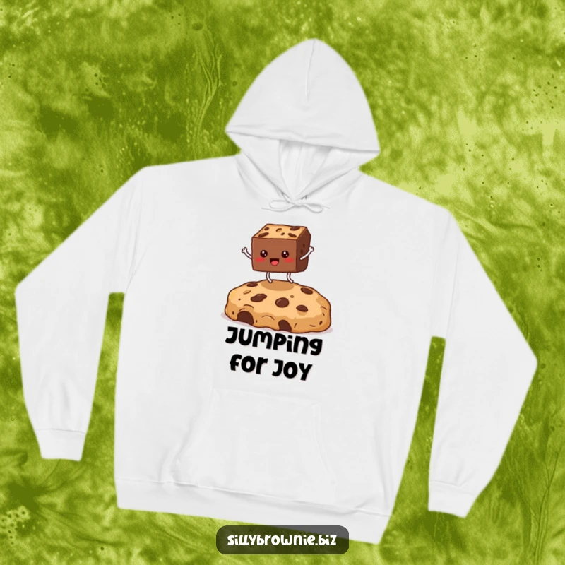 Funny hoodie featuring a square brownie character with legs in mid-air, jumping enthusiastically over a massive cookie crumb for comedic effect.