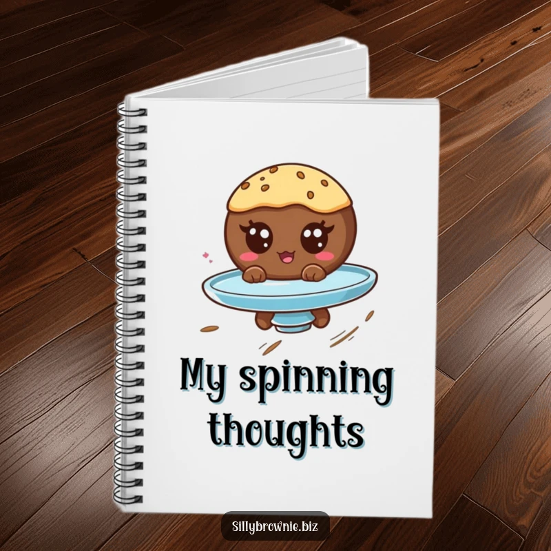 Funny notebook with a round brownie character with googly eyes spinning on a plate, great for jotting down whimsical thoughts.